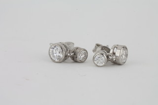 A pair of diamond ear studs, approx 1.10ct