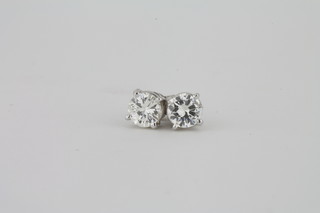 A pair of 14ct white gold diamond ear studs, approx 1ct