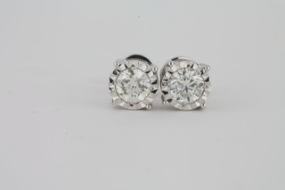 A pair of large 18ct gold solitaire diamond set ear studs with screw backs, approx 1.44ct