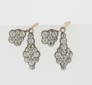 A pair of 9ct gold backed drop earrings set white stones