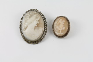 2 shell carved cameo brooches and a carved ivory flower head brooch