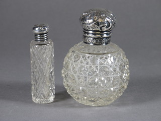 A Victorian globular cut glass scent bottle with silver lid 2"  together with a cylindrical scent phial