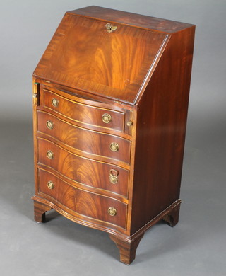 A Georgian style mahogany bureau, the fall front revealing a well fitted interior, the base of serpentine outline and fitted 4  long drawers, raised on bracket feet 21"w x 16"d x 38"h