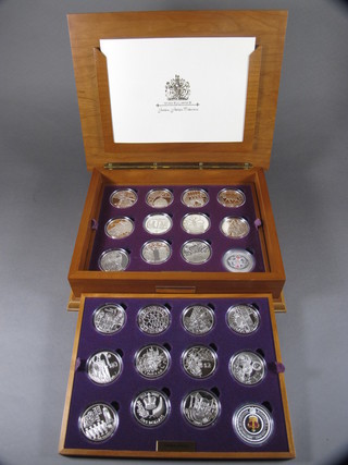 A cased set of 24 limited edition Golden Jubilee Commonwealth silver crowns