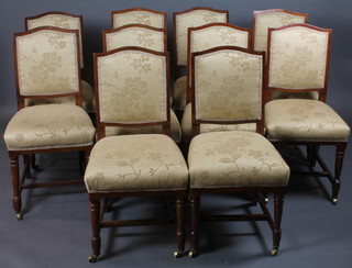 A set of 10 Edwardian mahogany dining chairs with upholstered  seats and backs, raised on turned supports with H framed  stretchers
