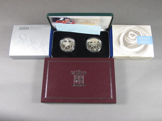 A 1977 and 2002 Jubilee silver proof crown set, cased, together  with a 1999 Diana Memorial silver proof crown, a 2006 80th  Birthday crown together with a Royal Mint Titanic silver proof  medal