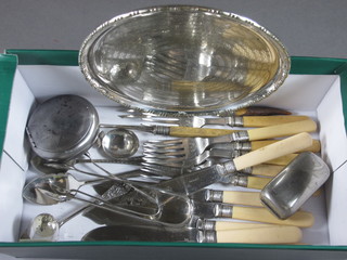 A circular engraved silver plated salver, a collection of fish knives and forks