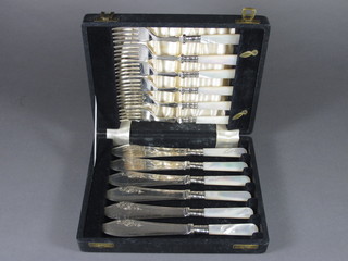 A set of 6 silver plated fruit knives with mother of pearl handles