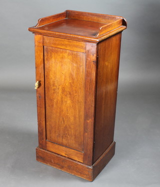 A Victorian mahogany pot cupboard with three-quarter gallery enclosed by a panelled door 18"w x 15"d x 39"h