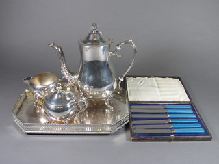 A silver plated 3 piece coffee service of oval form by Viners  together with a silver plated lozenge shaped tea tray 12" and a set  of 6 tea knives, cased