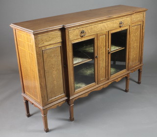 A Victorian mahogany breakfront sideboard fitted 1 long drawer above a double cupboard enclosed by panelled doors, heavily  inlaid throughout and raised on square tapering supports ending  in spade feet 60"w x 18"d x 39"h  ILLUSTRATED
