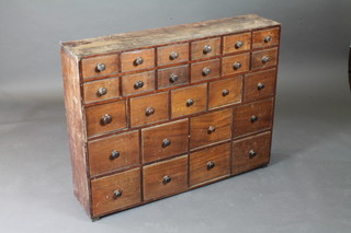 A Victorian pine and mahogany shop fitting, fitted 25 various drawers 43"w x 9 1/2"d x 33"h