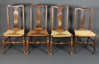 A set of 4 18th Century elm slat back dining chairs with woven  cane seats, raised on club supports