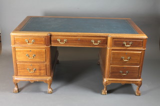 An oak inverted breakfront kneehole pedestal desk with inset blue  writing surface above 1 long and 6 short drawers, raised on  cabriole supports 60"w x 36"d x 29"h