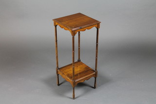 A Georgian style mahogany 2 tier occasional table raised on  turned supports 12"w x 12"d x 28"h