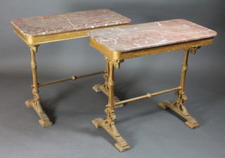 A pair of Victorian gilt painted iron framed occasional tables  with pink veined marble tops 36"w x 18"d x 32"h