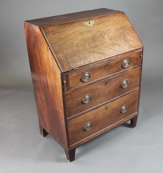 A Georgian mahogany bureau with fall front revealing a well  fitted interior above 3 long graduated drawers, raised on bracket  feet 30"w x 19"d x 40"