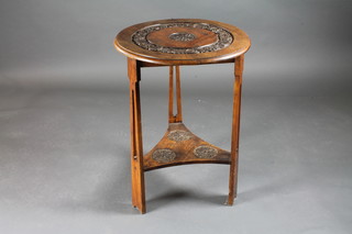 An Art Nouveau circular carved mahogany cricket table raised on  pierced panel supports with undertier 21" x 30"h