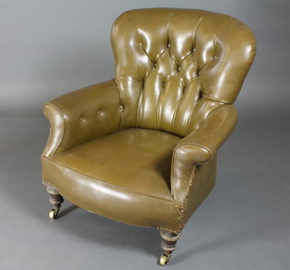A Victorian tub chair upholstered in green material  ILLUSTRATED