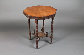 A Victorian walnut octagonal 2 tier occasional table raised on  turned supports 22"w x 28"h