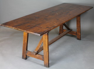 An elm trestle refectory table with planked top, raised on trestle supports 86 1/2"w x 31 1/2"d x 30"