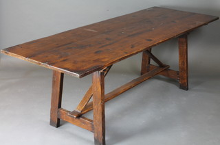 An elm trestle refectory table with planked top, raised on trestle supports 86 1/2"w x 31 1/2"d x 30"