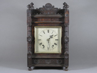 A 19th Century striking bracket clock with square silvered dial and Roman numerals contained in an oak case