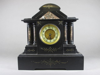 A Victorian French 8 day mantel clock with porcelain dial and Arabic numerals contained in a black marble architectural case