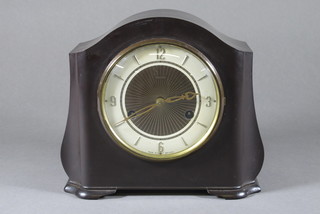 An Art Deco 8 day striking mantel clock with Arabic numerals contained in an arched brown Bakelite case by Smiths