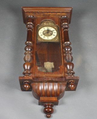A striking Vienna regulator with 7 1/2" arch brass shaped dial with enamelled chapter ring, contained in a walnut case