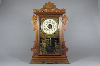 An American shelf clock with paper dial and Arabic numerals by Smith Thomas, contained in a carved walnut case