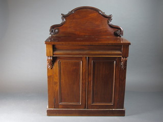 A Victorian mahogany chiffonier with raised back, the base fitted  a cupboard enclosed by panelled doors raised on a platform base  36"w x 17"d x 49"h