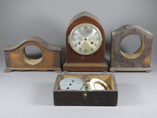 An inlaid mahogany lancet clock case, 2 wooden clock cases and a collection of various clock dials