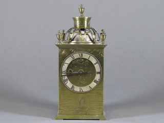 A mantel clock with 3" silvered chapter ring contained in a gilt metal case