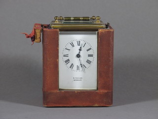 A 19th Century carriage clock with enamelled dial and Roman  numerals contained in a gilt metal case, the dial marked R Taylor  Bromley complete with section of original carrying case