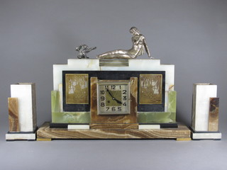 An impressive Art Deco 3 piece striking clock garniture with  square silvered dial and Arabic numerals contained in a 4 colour  marble case, surmounted by a figure of a reclining naked lady  and monkey, together with 2 side pieces   ILLUSTRATED
