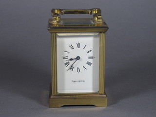 A carriage clock with enamelled dial and Roman numerals  contained in a gilt metal case by Mappin & Webb