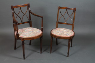 An Edwardian inlaid mahogany open arm bar back chair with X framed mid rail and upholstered seat, raised on turned supports,  together with a matching standard chair