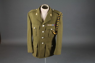 A Royal Logistics Corps Major Service dress jacket mounted on  a mannequin