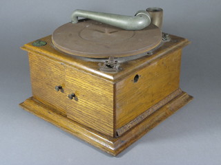 A Cinch Zonophone gramophone contained in an oak case,  missing horn,