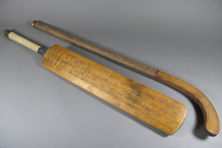 A Wellington Peter May cricket bat together with an Oakmead  Abbey hockey stick