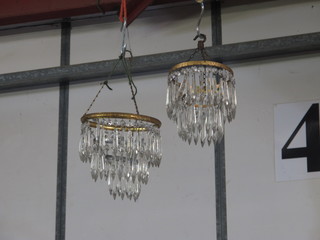 2 circular glass light shades hung lozenges