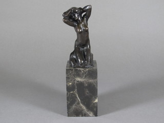 An Art Deco style bronze figure of a naked kneeling lady, raised on square marble base 10"