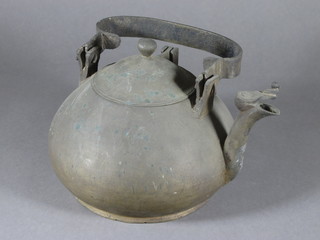 An Eastern circular bronze kettle with iron handle 8"