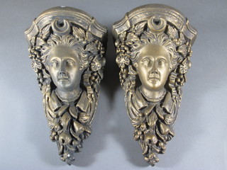 A pair of gilt painted plaster wall brackets in the form of heads of classical ladies 11"