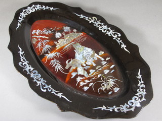 A red lacquered and inlaid mother of pearl boat shaped tray decorated a buffalo 19"