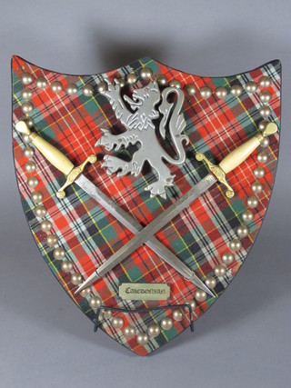 A pair of Wilkinson Sword double edged poynards mounted on a tartan shield 11"