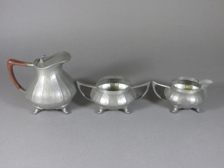 A Civic planished pewter 3 piece tea service with hotwater jug,  twin handled sugar bowl and milk jug