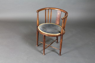 An Edwardian inlaid mahogany tub back chair with X framed  stretcher on turned supports