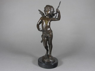 A bronze figure of a standing cherub, raised on a marble base  15"